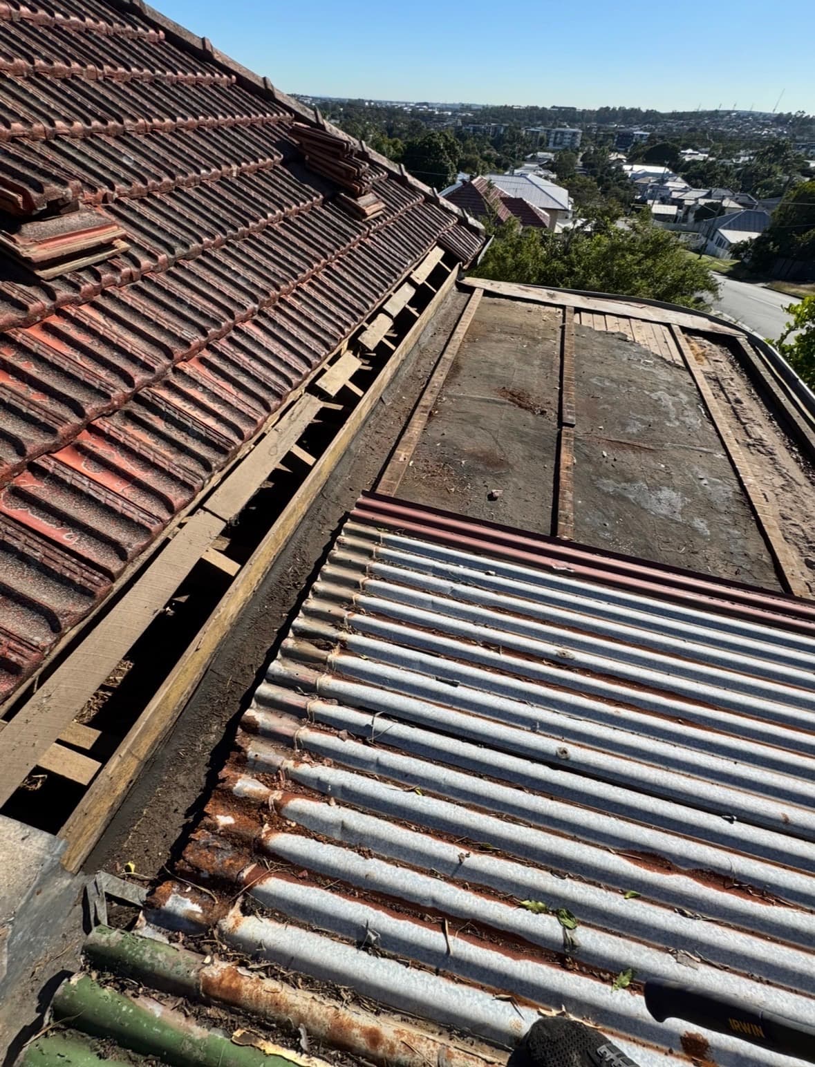 Second roof before restoration - rusted and missing sections